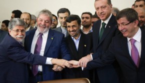 Brazilian FM Amorim Iranian President Ahmadinejad, Brazilian President da Silva, Turkish PM Erdogan and Turkey's FM Davutoglu hold their hands as sign of unity during signing agreement ceremony in Tehran